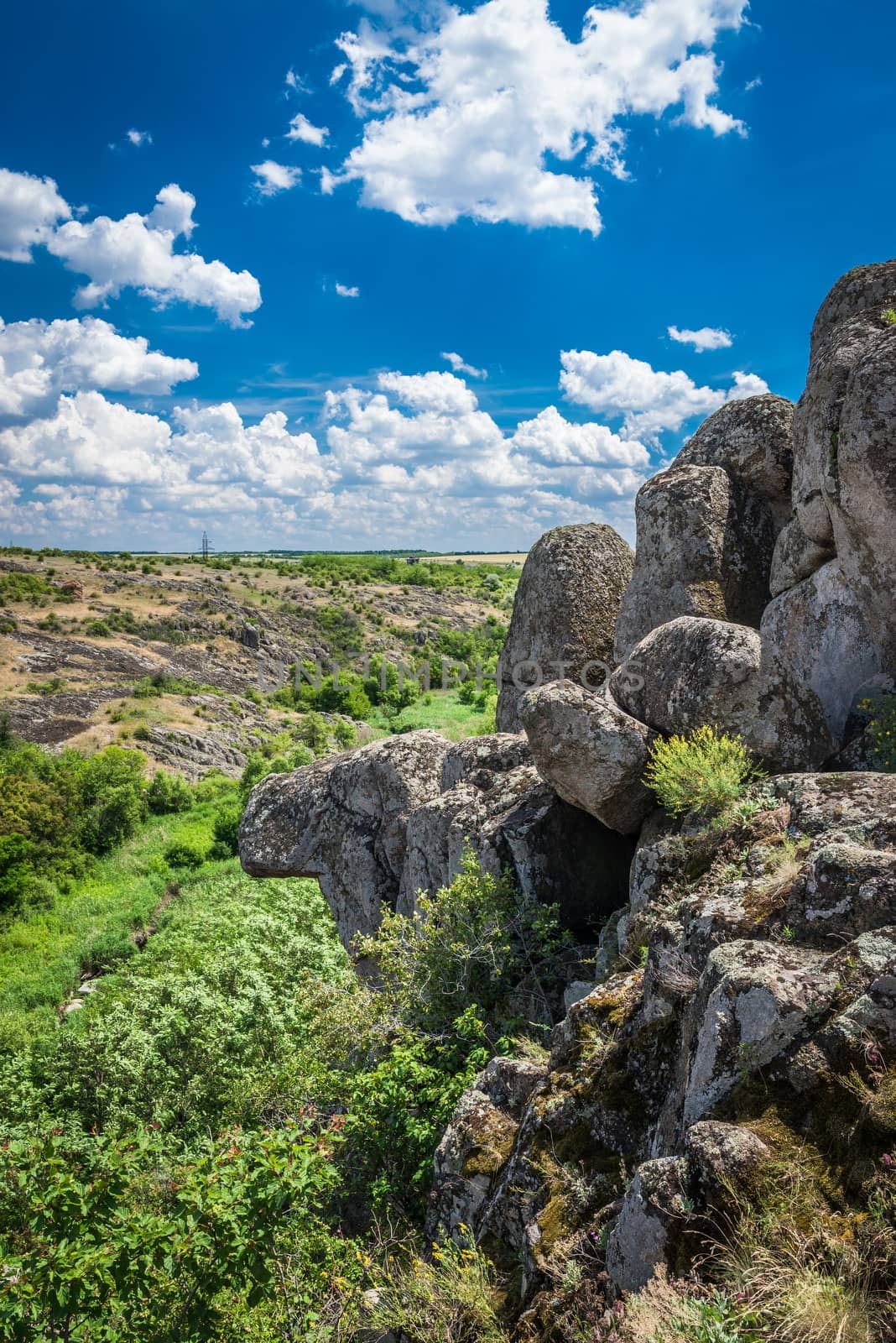 Panoramic view of deep granite Aktovo canyon with river and cloudy sky, One of the natural wonders of Ukraine.