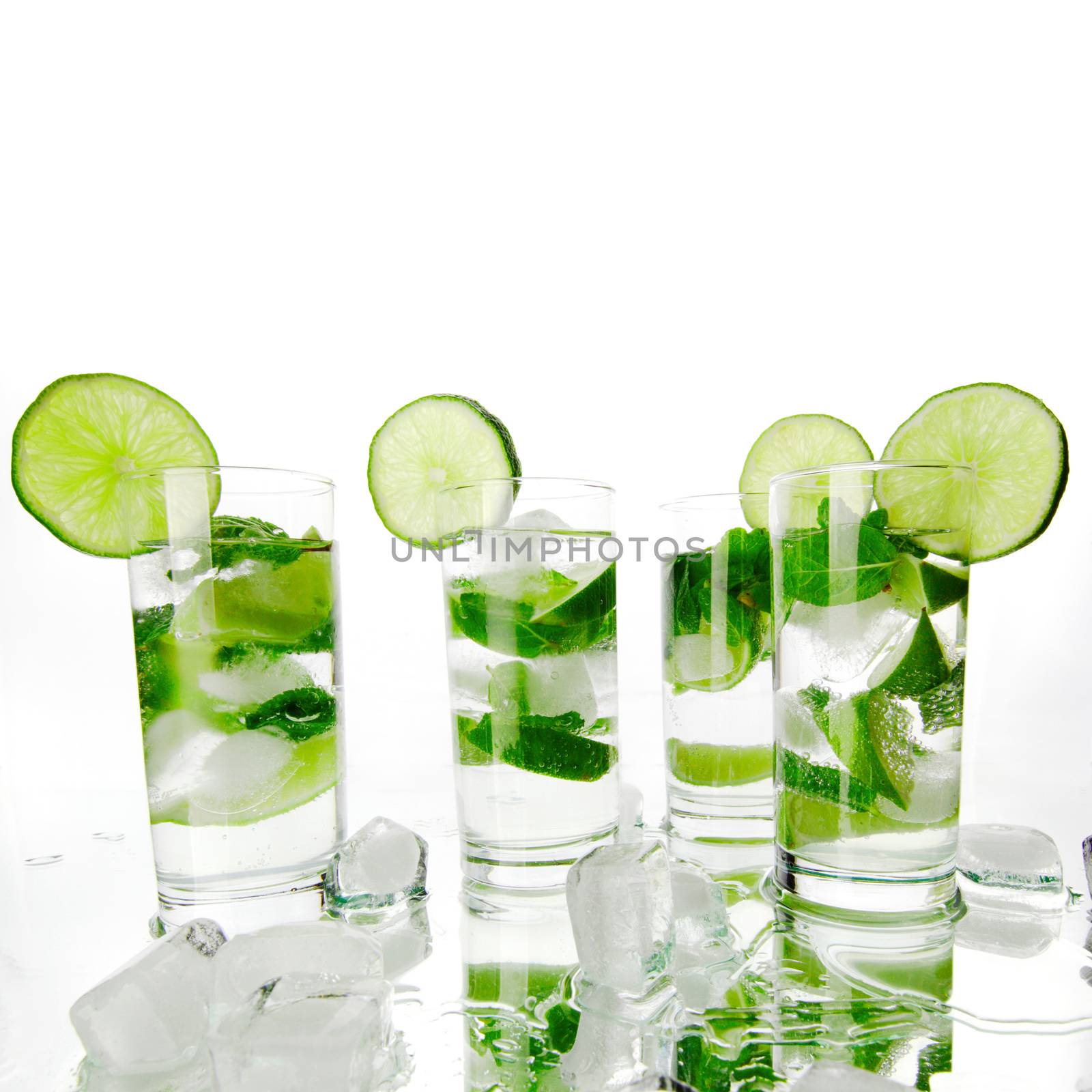 Mojito cocktails with lime and mint isolated on white background