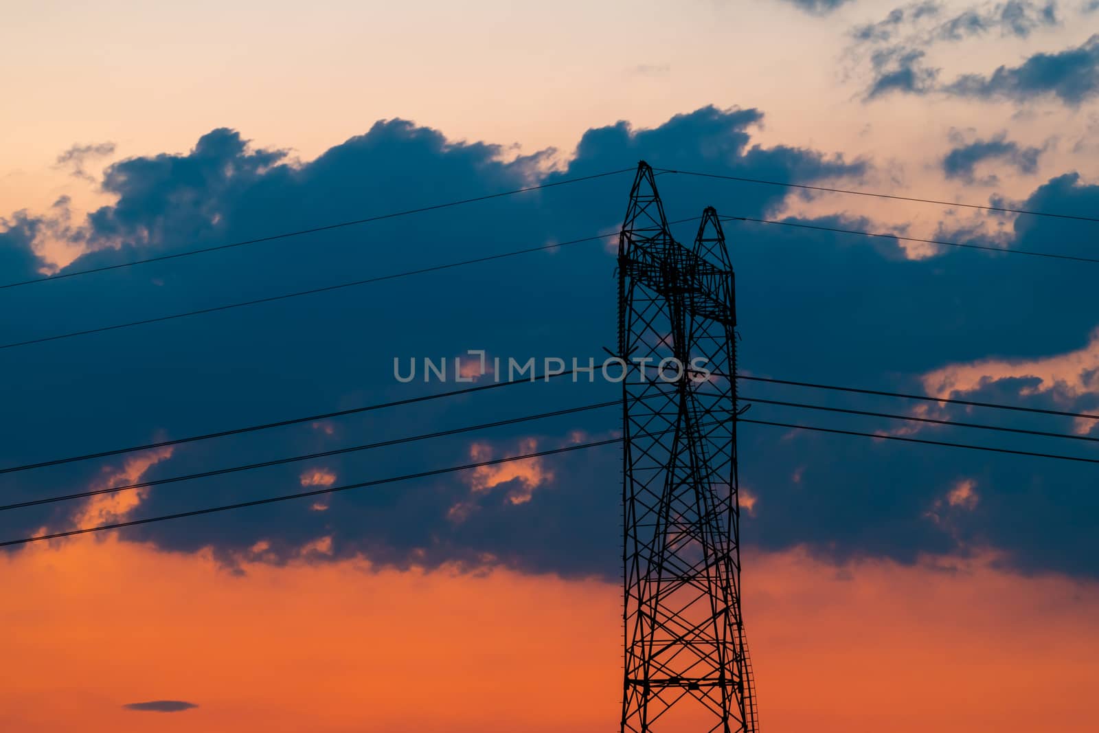 Silhouette of High voltage electric pylon, tower in sunset by asafaric