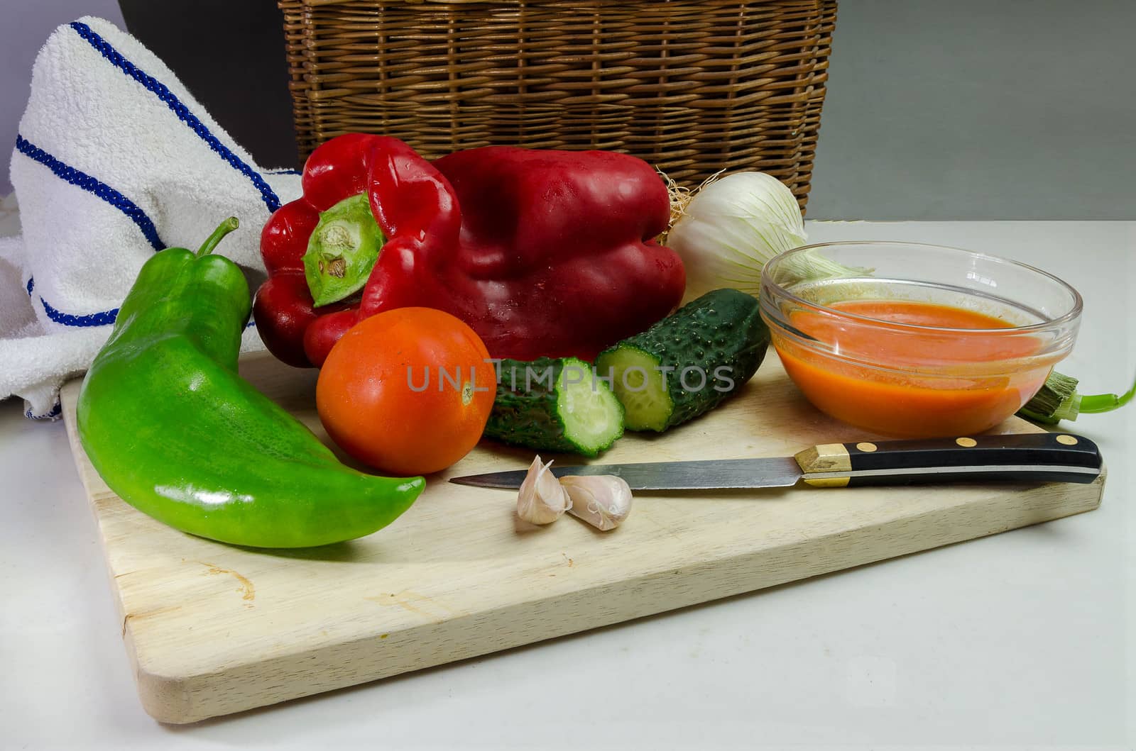 Gazpacho is a cold soup with ingredients such as olive oil, vinegar and raw vegetables: usually tomatoes, cucumbers, peppers, onions and garlic and bread. It is usually served fresh in the hot summer months.