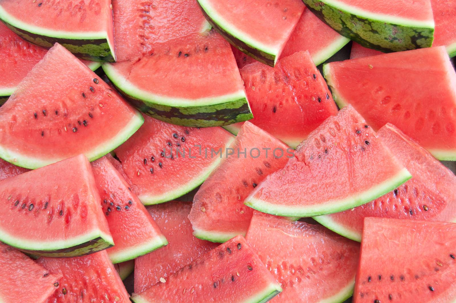Many fresh watermelon slices close up