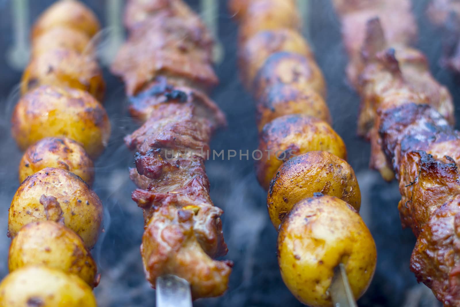 Barbecue kebab cooking. Grill potatoes dinner cook. Tasty food BBQ background. Roasted fresh beef meat