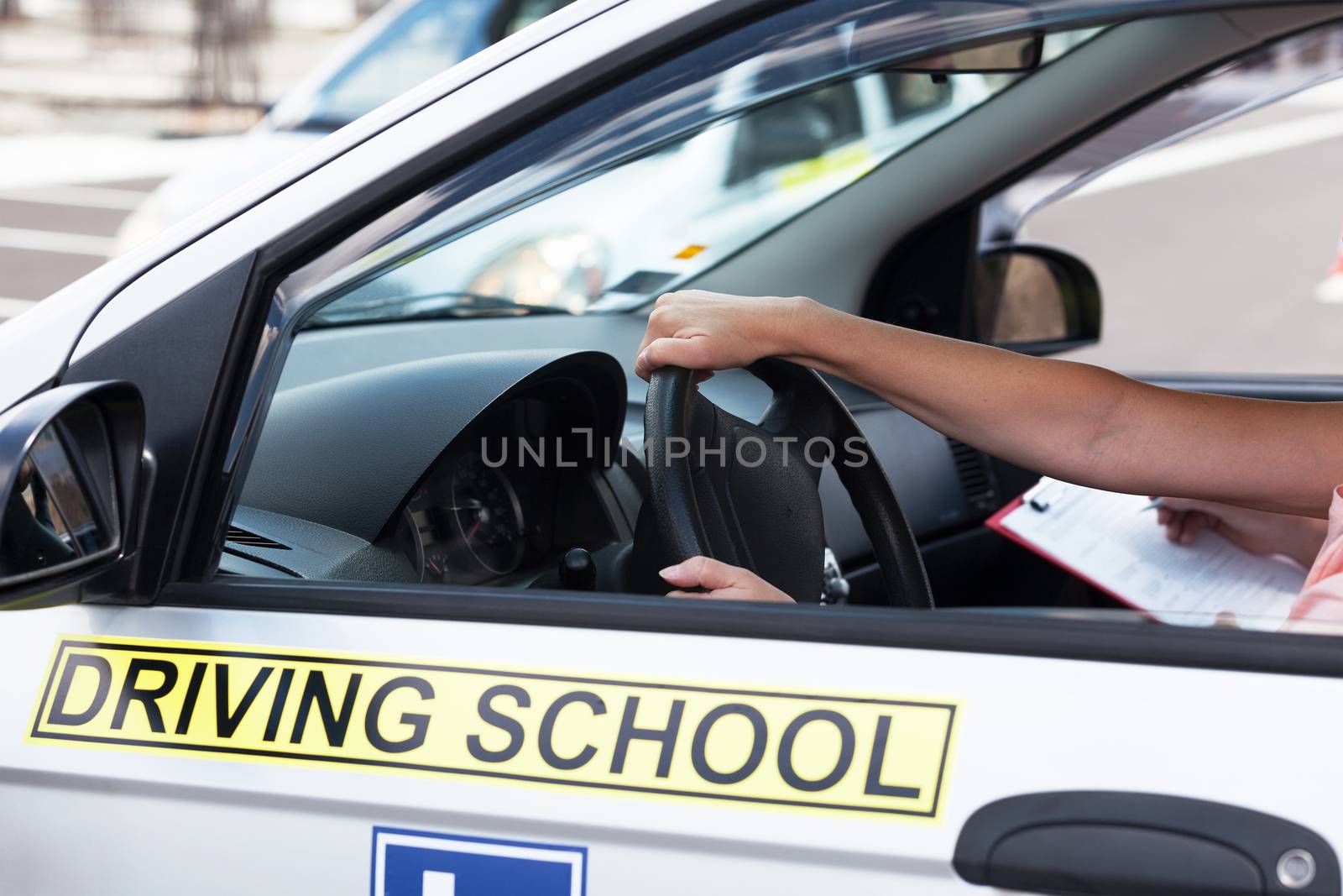 Student driver. Learning to drive a car. Driving school. by wellphoto