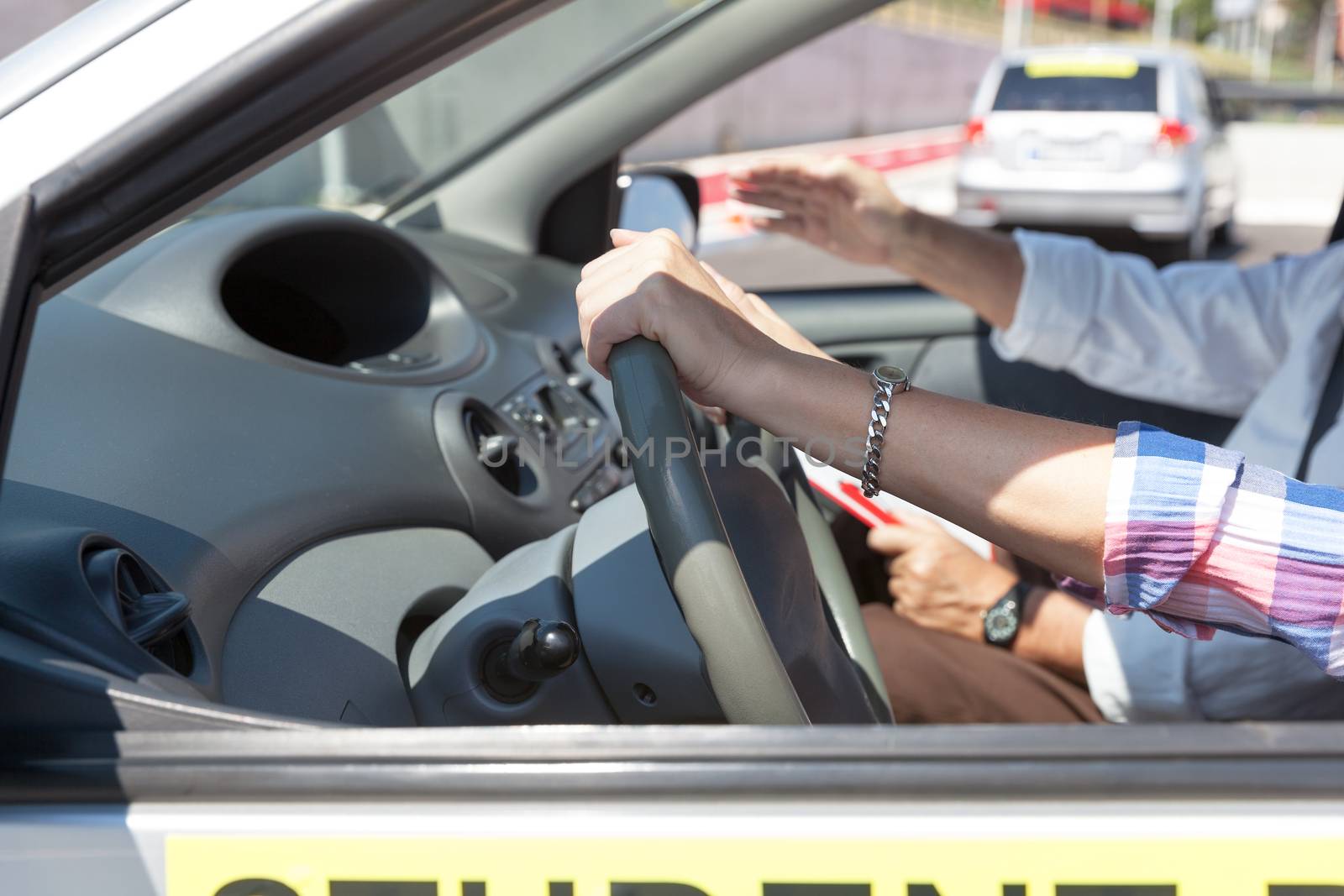  Student driver. Learning to drive a car. by wellphoto