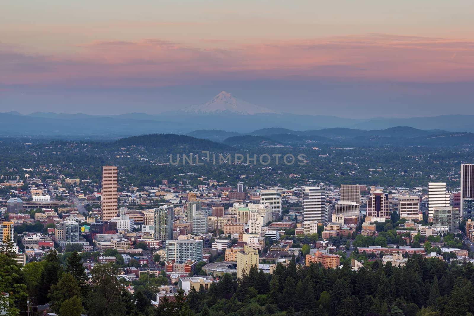 Alpenglow over Mount Hood and cityscape of downtown Portland Oregon after sunset