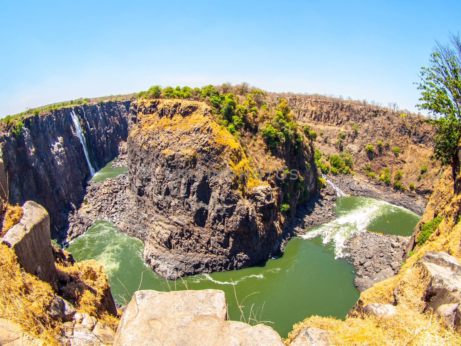 Victoria Falls on Zambezi River. Dry season. Border between Zimbabwe and Zambia, Africa. Fisheye shot by pyty