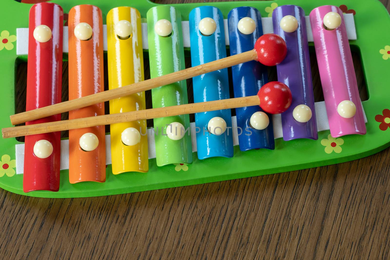 Musical instrument xylophone. Rainbow colored toy xylophone.