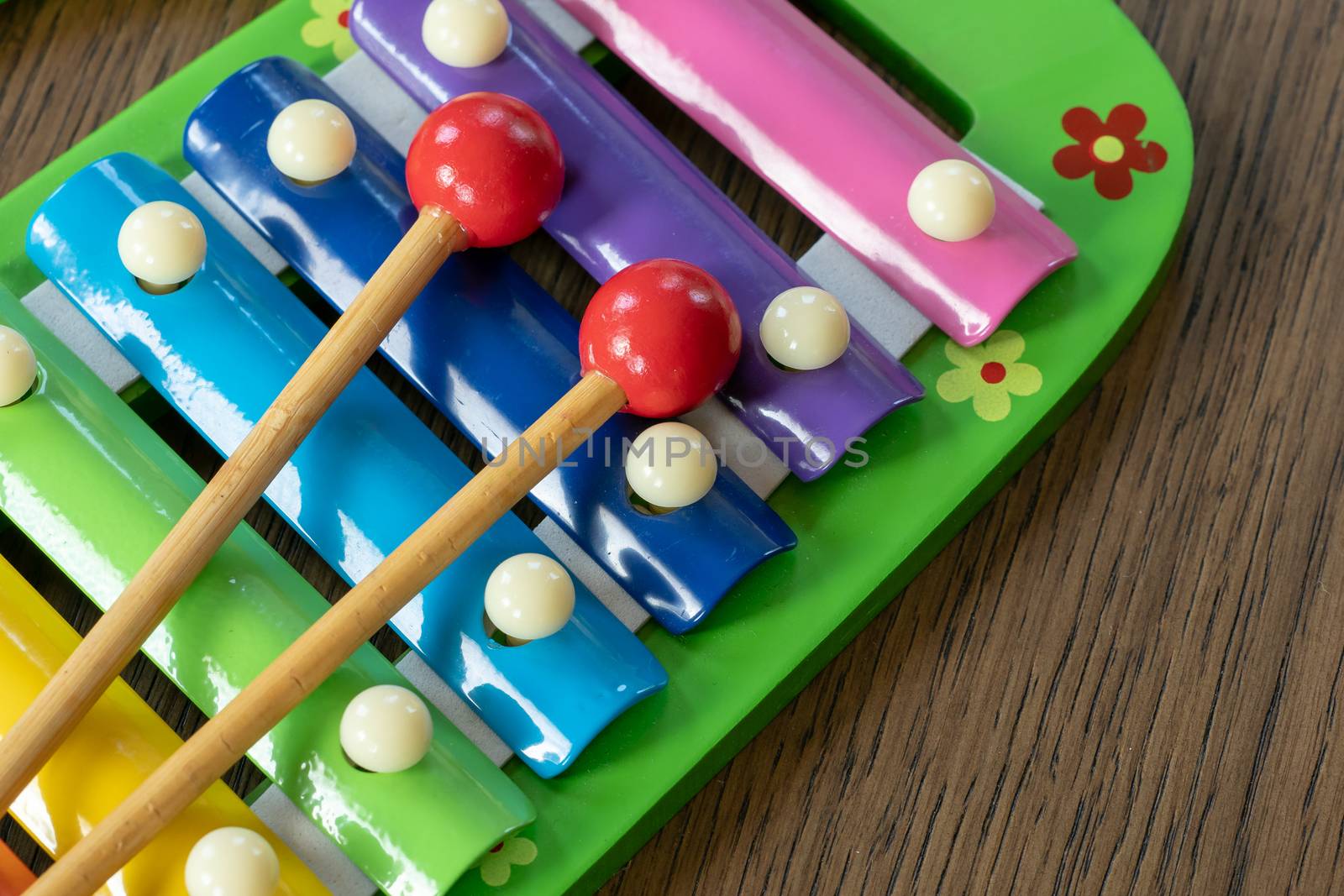 Musical instrument xylophone. Rainbow colored toy xylophone.