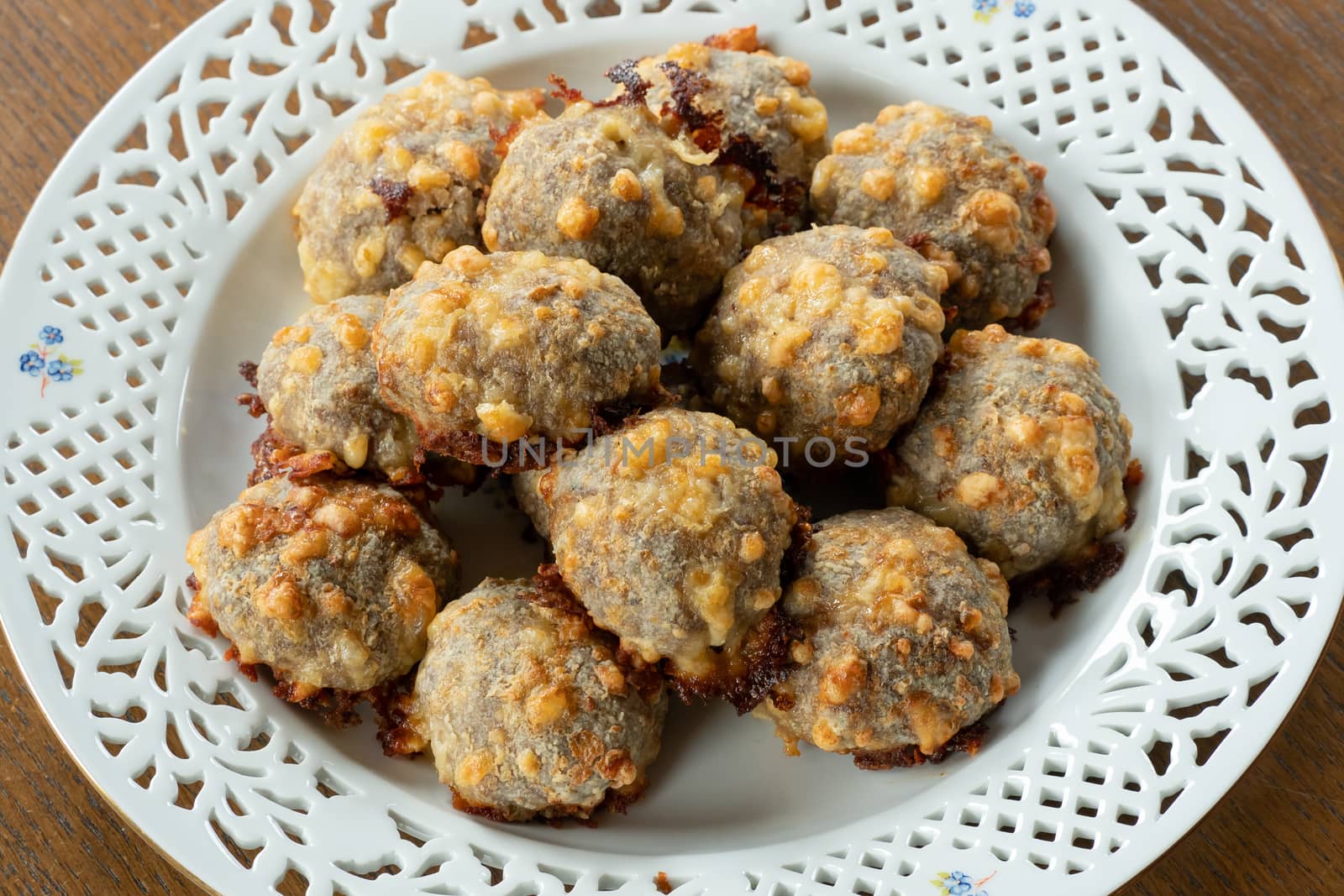 Homemade food, meat balls with cheese.