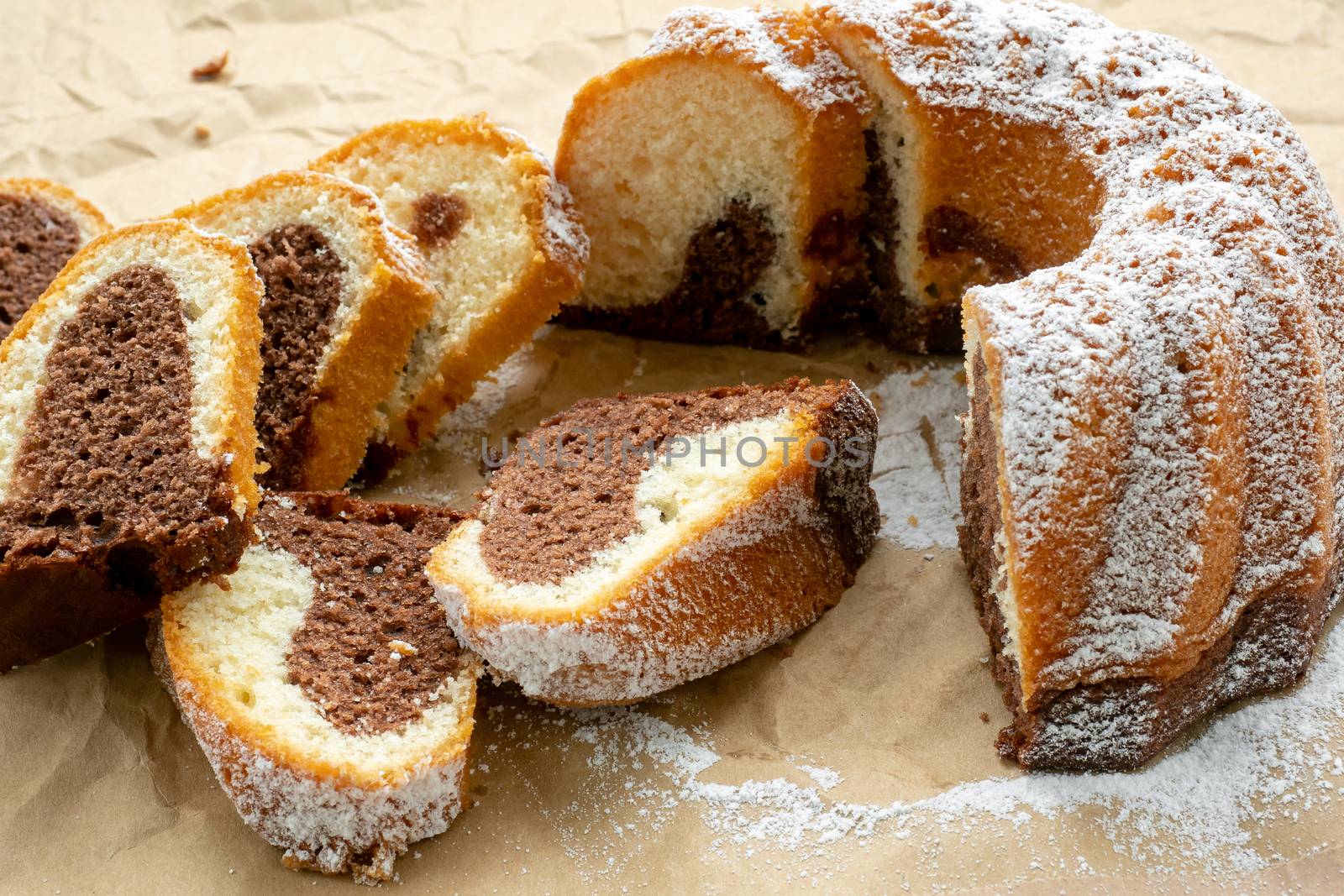 Traditional homemade marble cake. Sliced marble bundt cake on pa by xtrekx