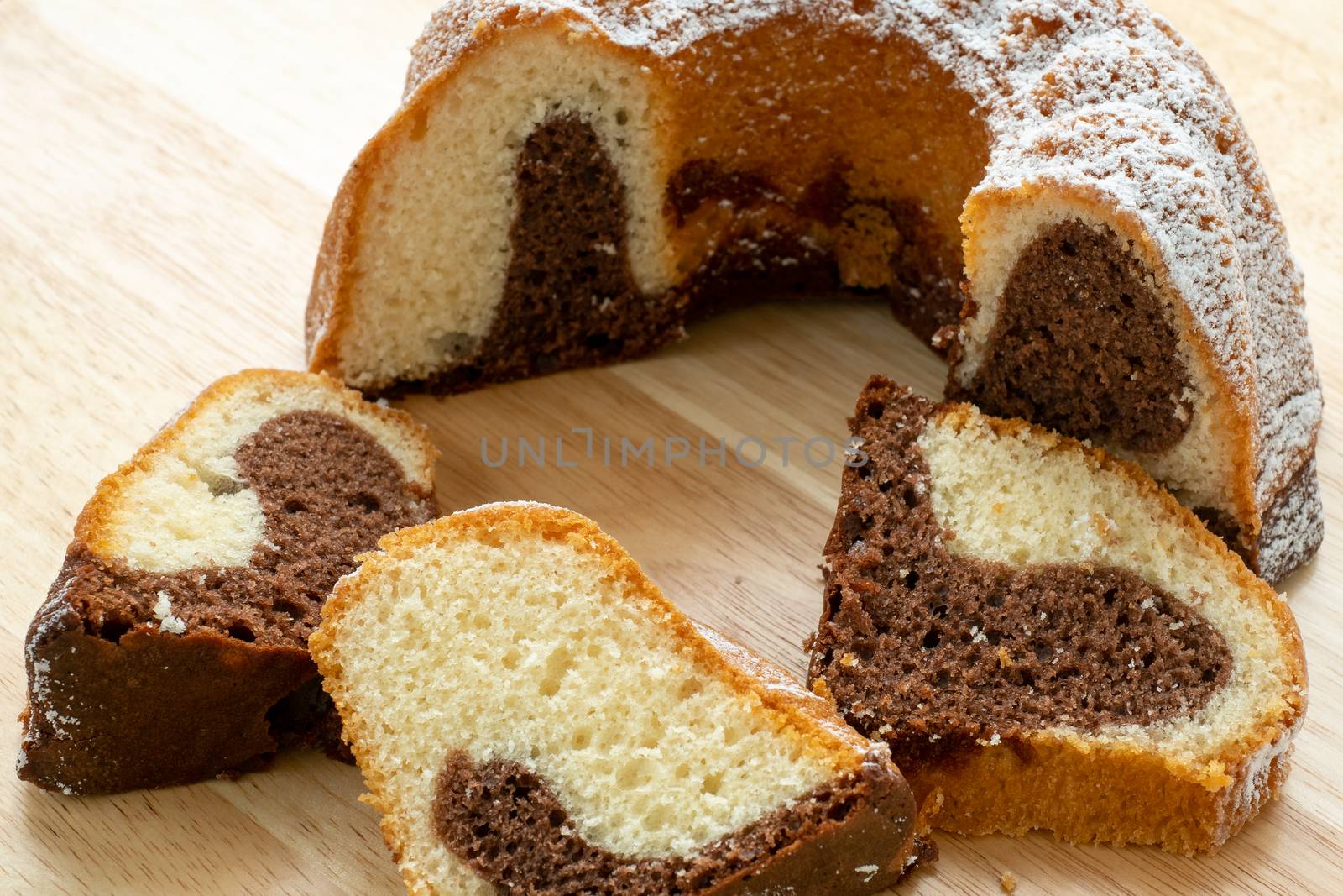 Traditional homemade marble cake. Sliced marble bundt cake on wo by xtrekx