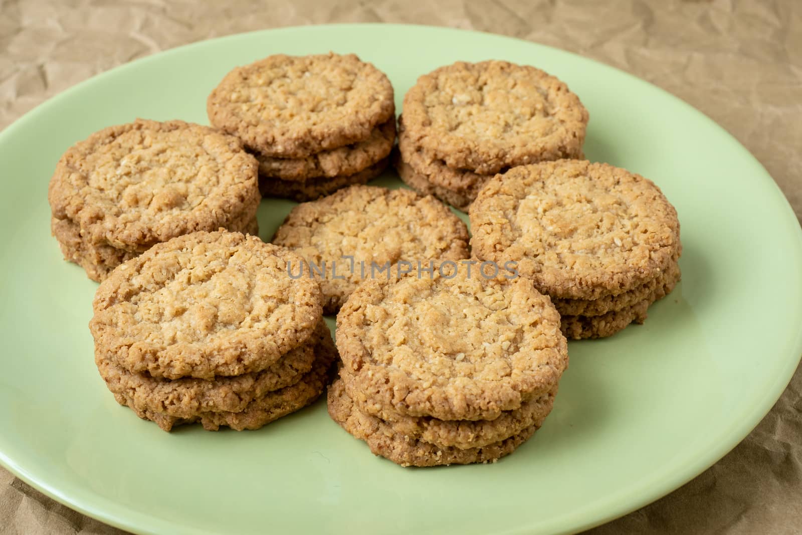 Tasty cookies biscuits. Stack of sugar cookies biscuits in green by xtrekx