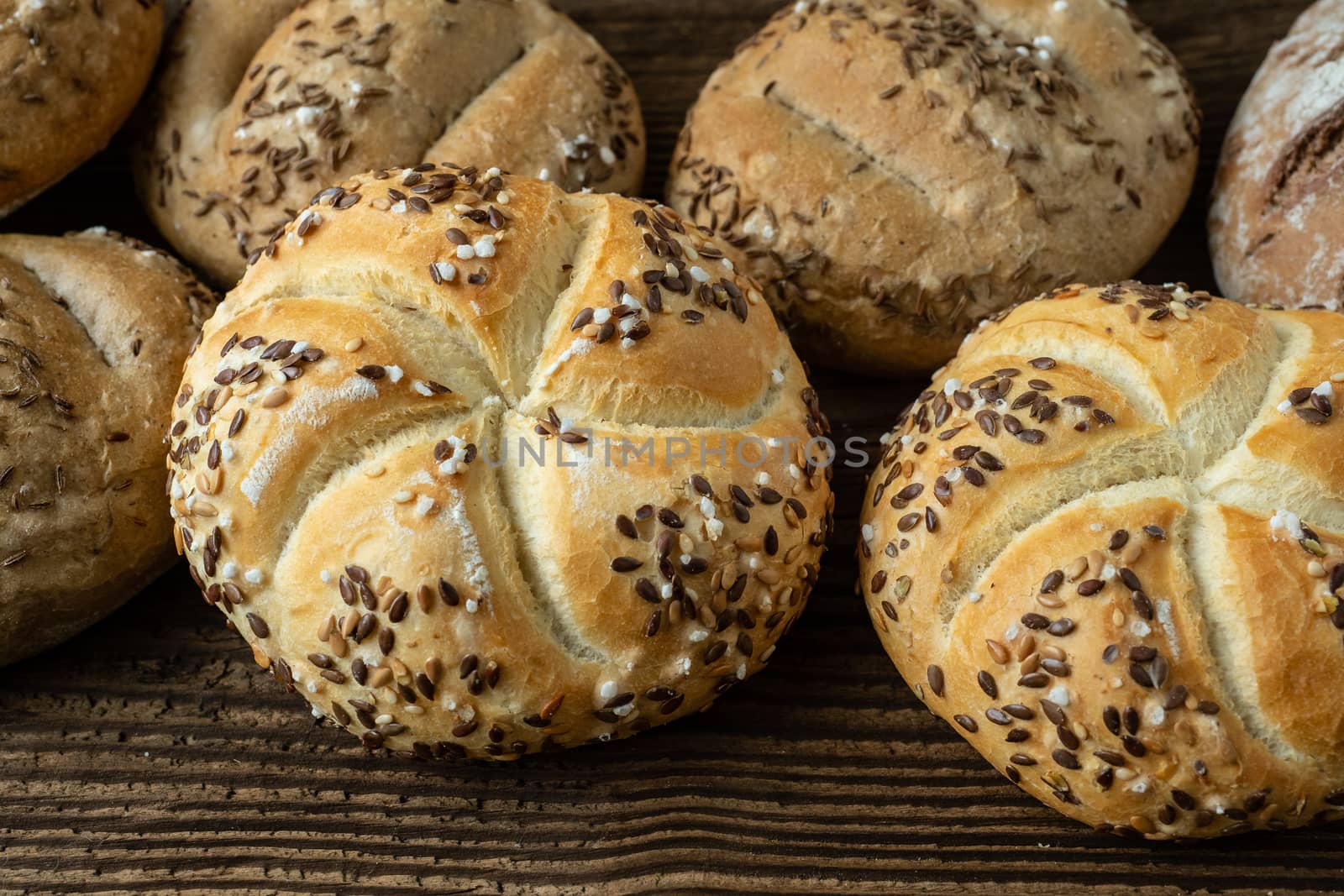 Different bread on a rustic wooden background. Bakery assortment of bread.