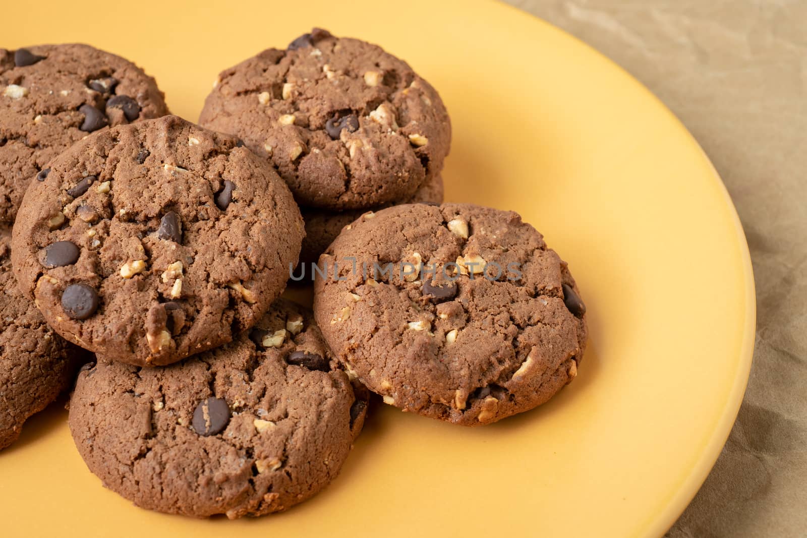 Chocolate cookies on plate by xtrekx