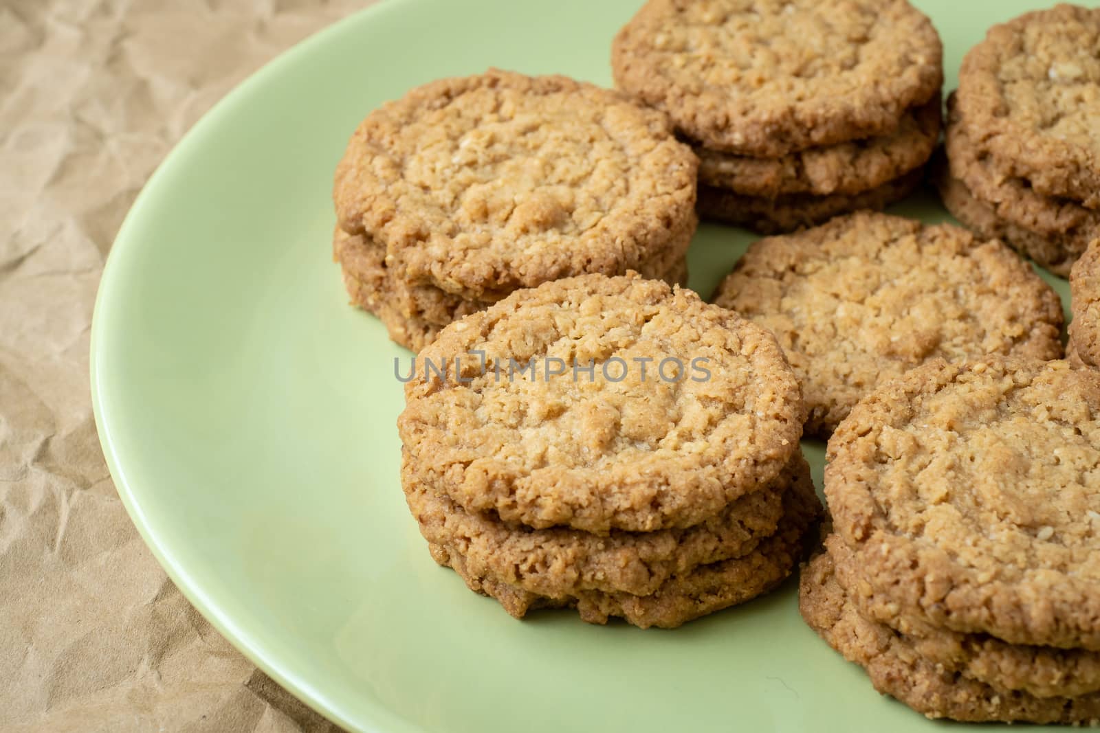 Tasty cookies biscuits. Stack of sugar cookies biscuits in green plate.