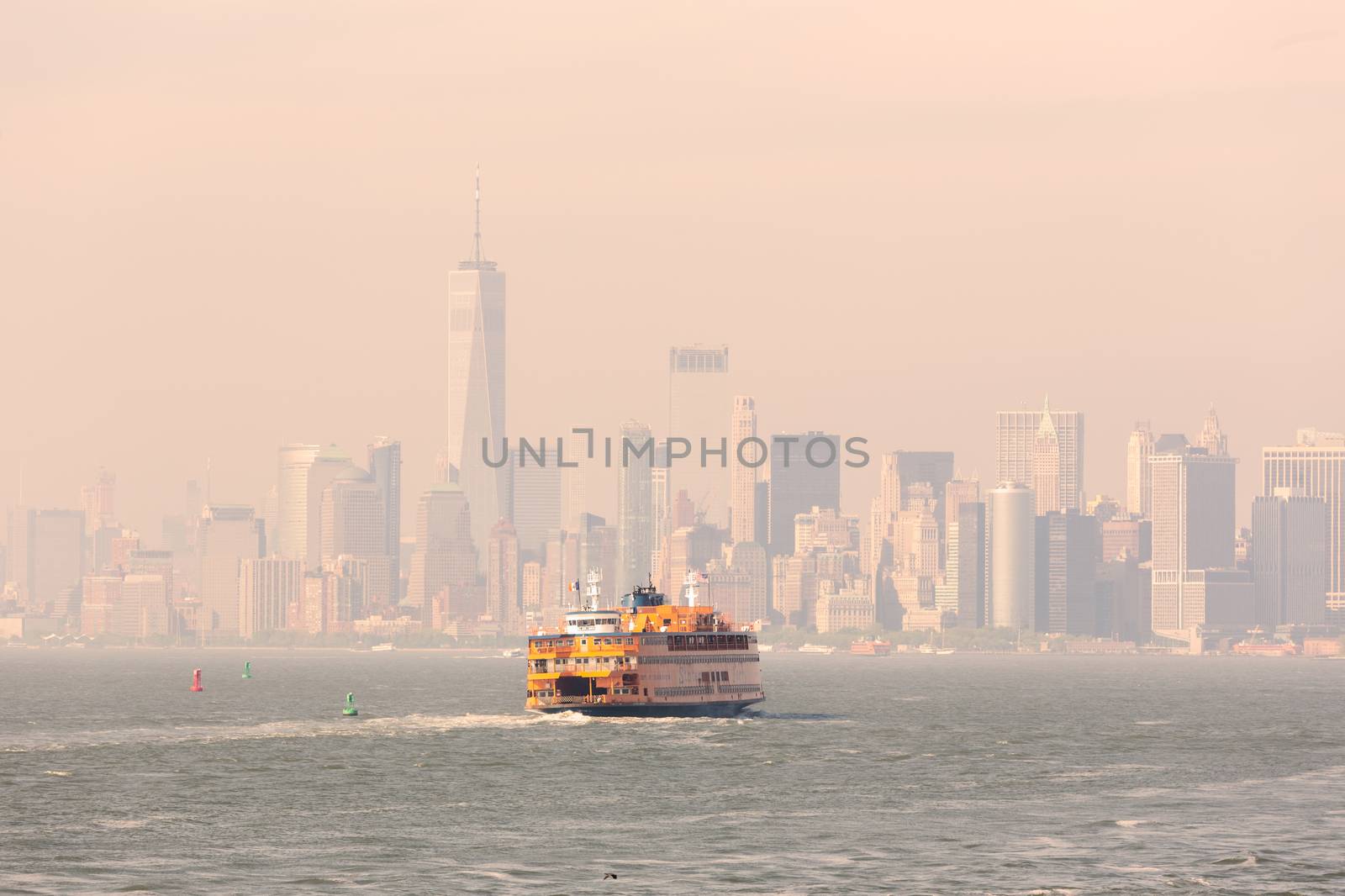 Staten Island Ferry and Lower Manhattan Skyline, New York City, USA.