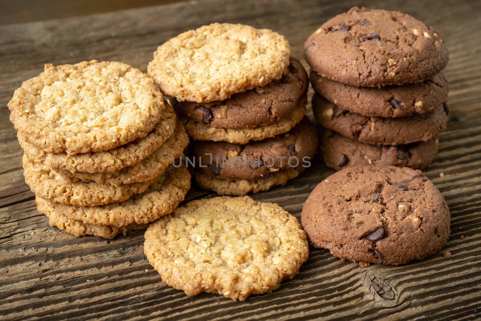 Various tasty cookies biscuits on wooden background by xtrekx