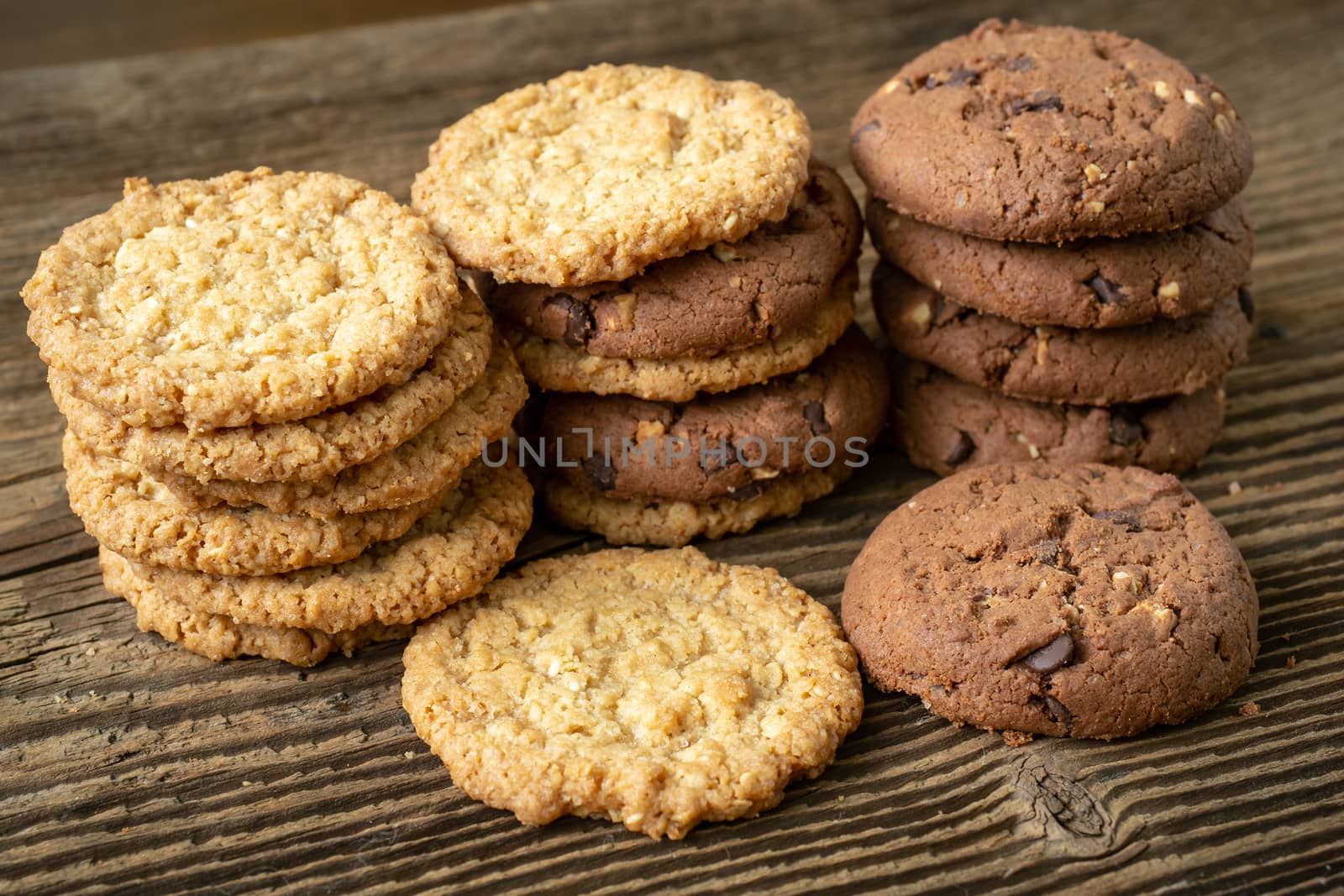 Various tasty cookies biscuits on wooden background