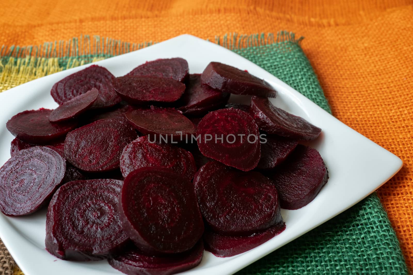 Beetroot (beet) chopped for salad in plate. Healthy ingredient for cooking. Cooked beet.