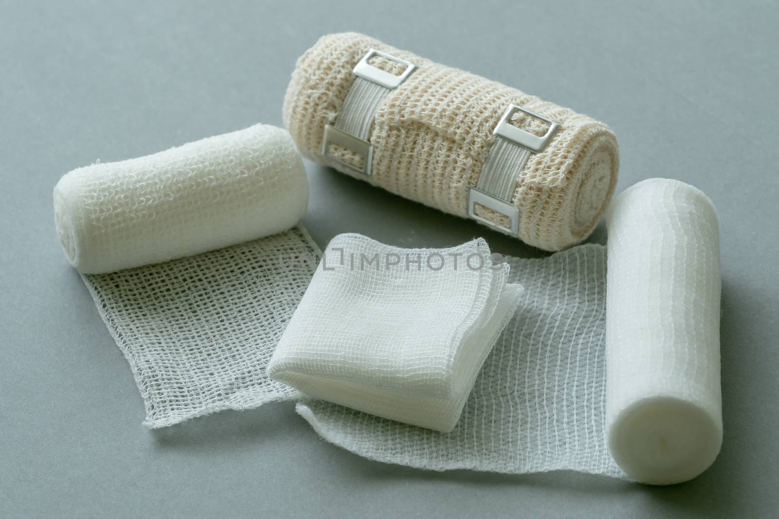 Medical bandages on gray background. Medical equipment.