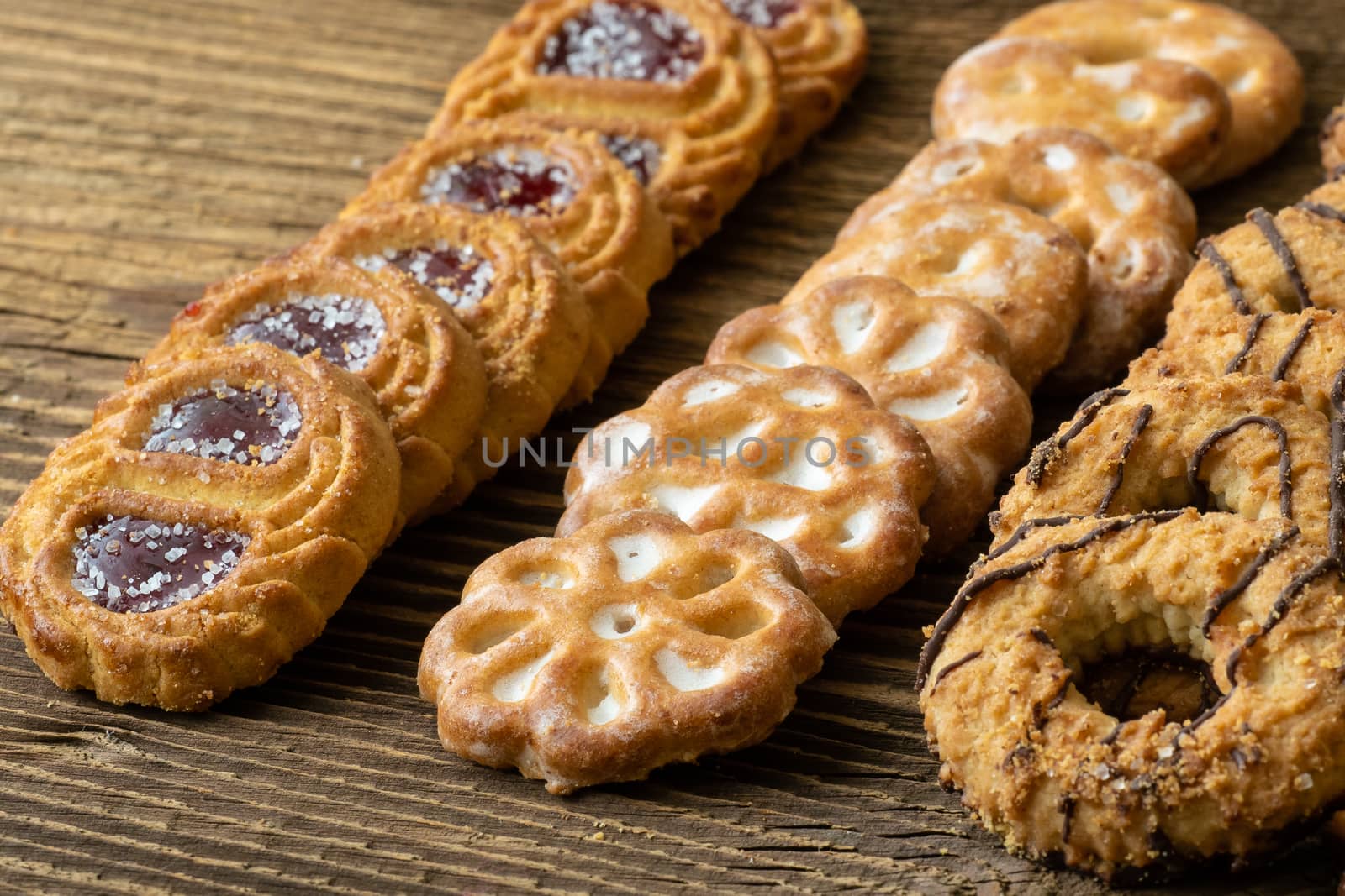 Various cookies on old wooden table