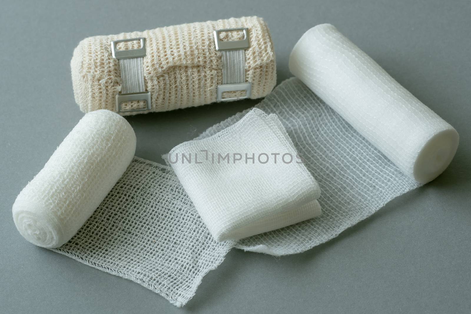 Medical bandages on gray background. Medical equipment.