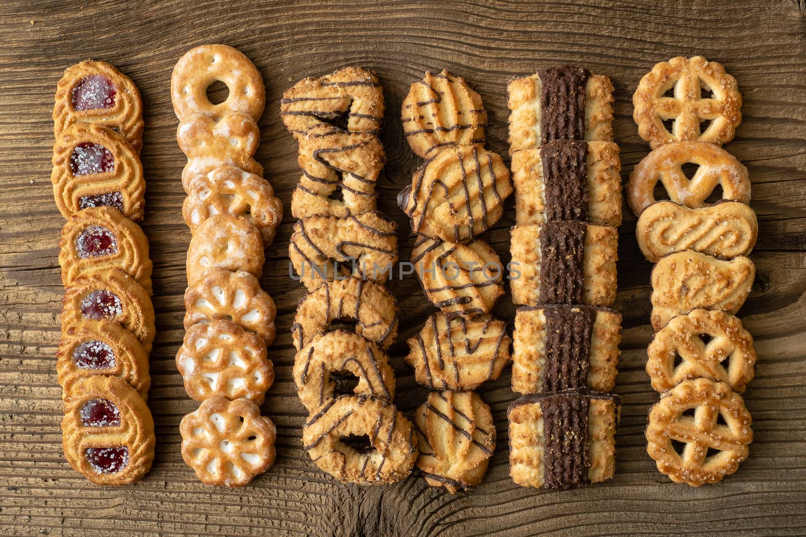 Various cookies on old wooden table