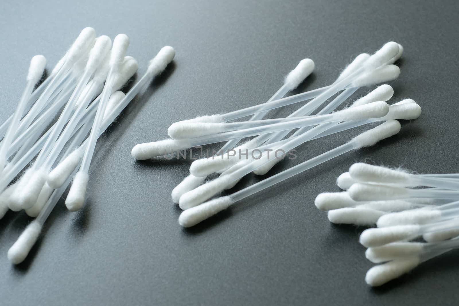 Cotton buds for cleaning ears. White cotton buds or cotton swab on black background.