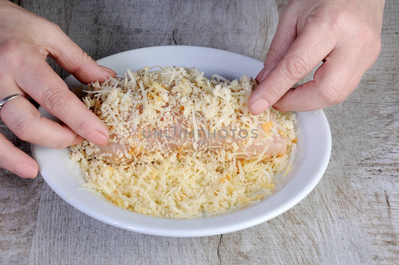   Cooking. Breaded stuffed chicken roll in a mixture of crumb breadcrumbs with grated parmesan cheese. . Step-by-step recipe. Stage preparation for cooking dishes. Series.