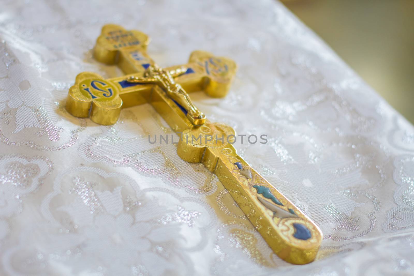 Church utensil on an altar cross on table ceremony of christening