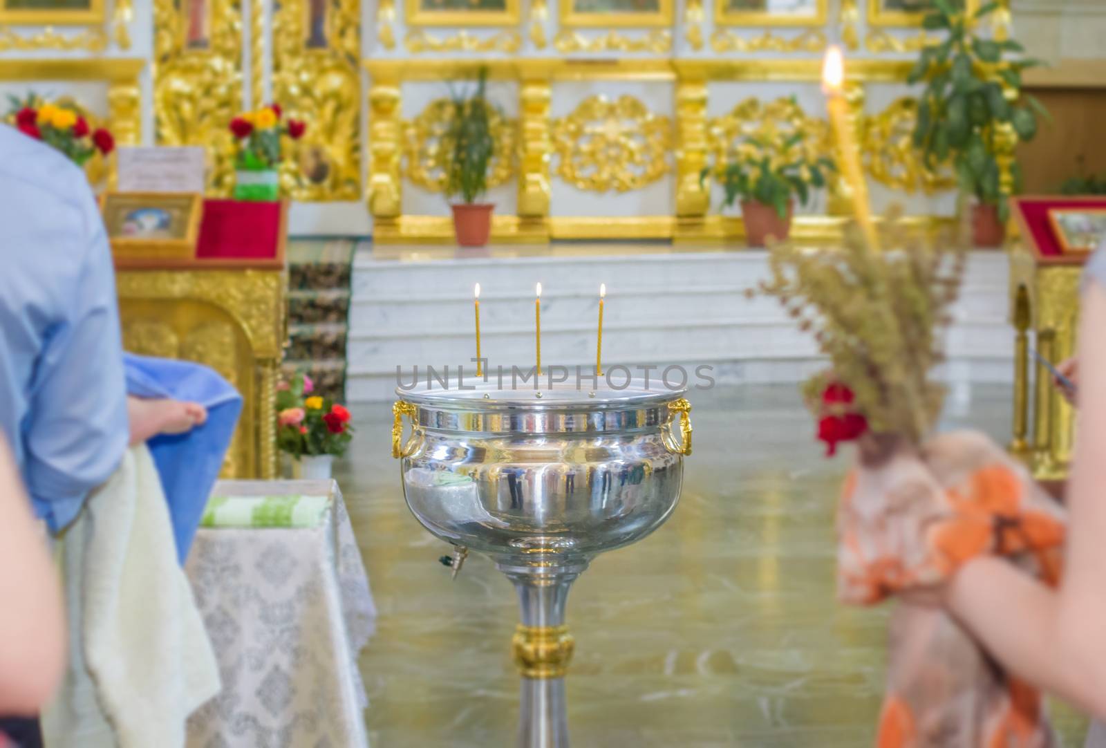 Orthodox bowl of holy water and candles for christening. Moldova