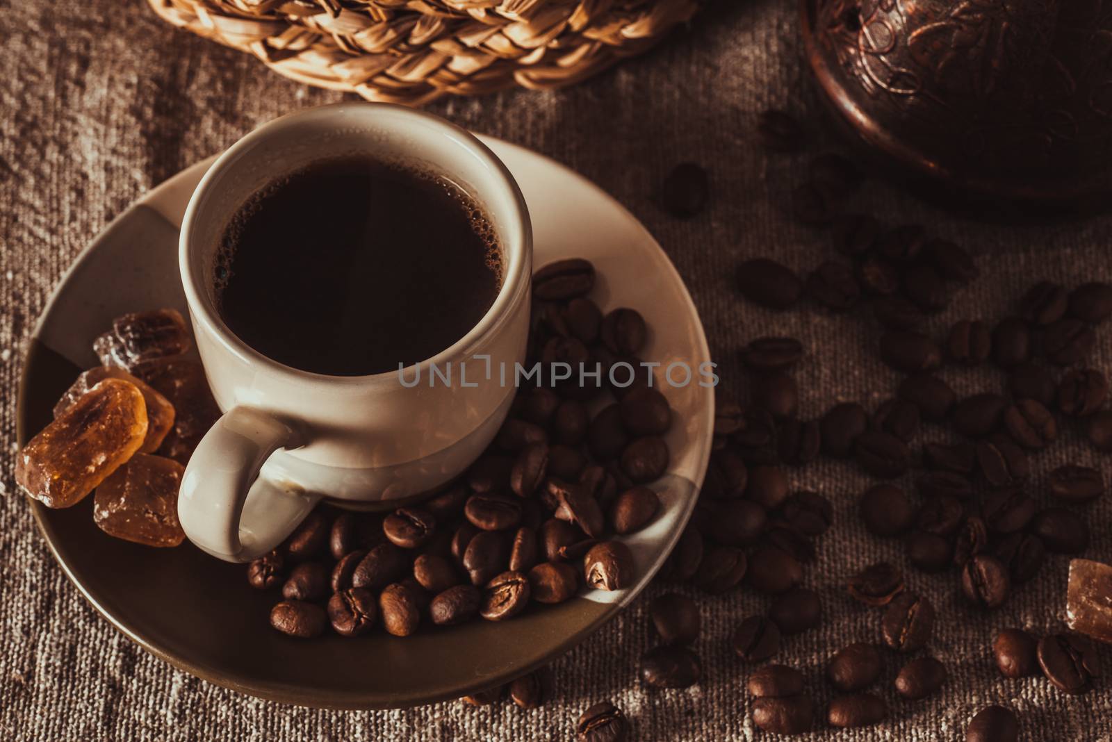cup of coffee with beans, dark candy sugar and pot by Seva_blsv