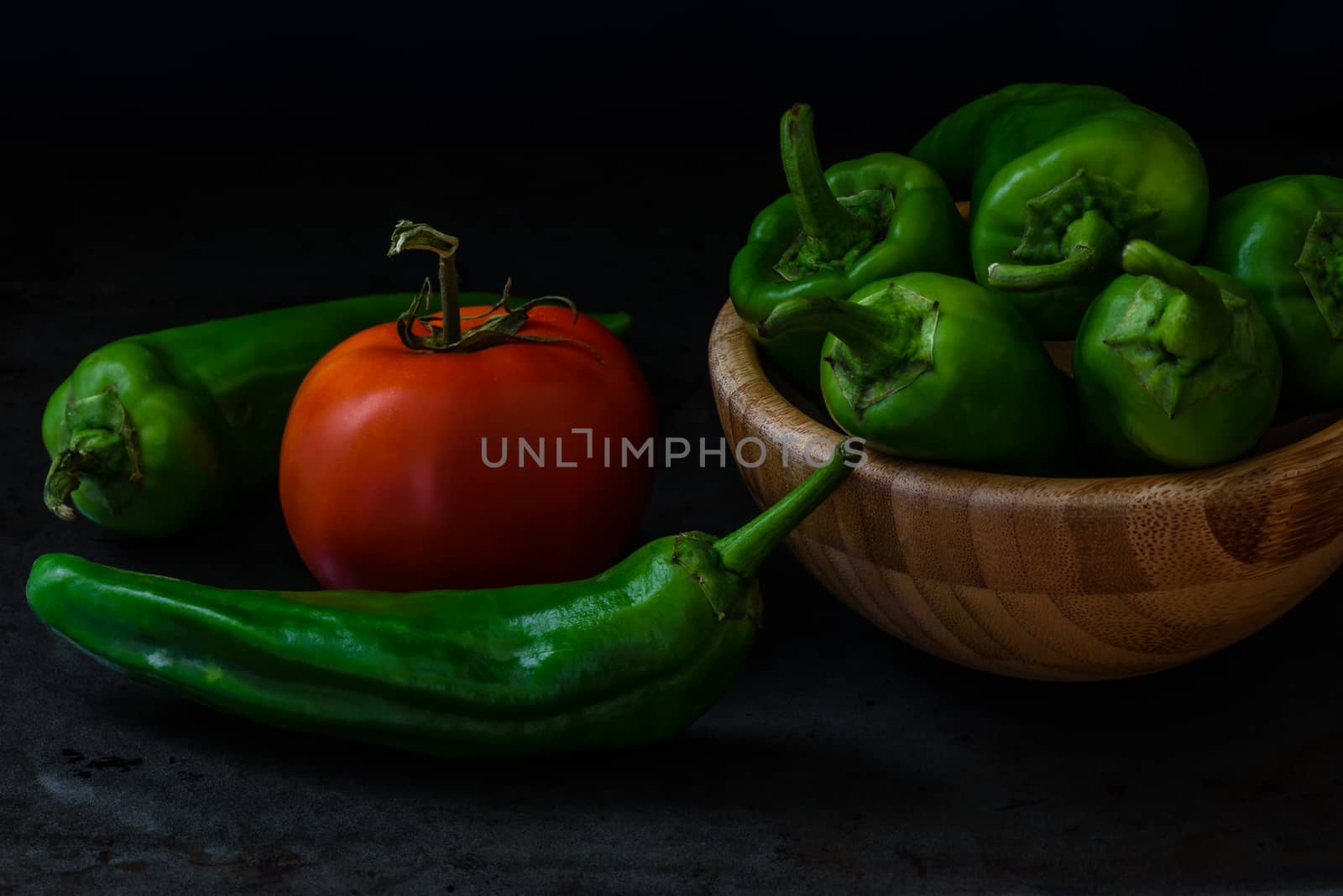 chili pepper and tomato on dark background by Seva_blsv