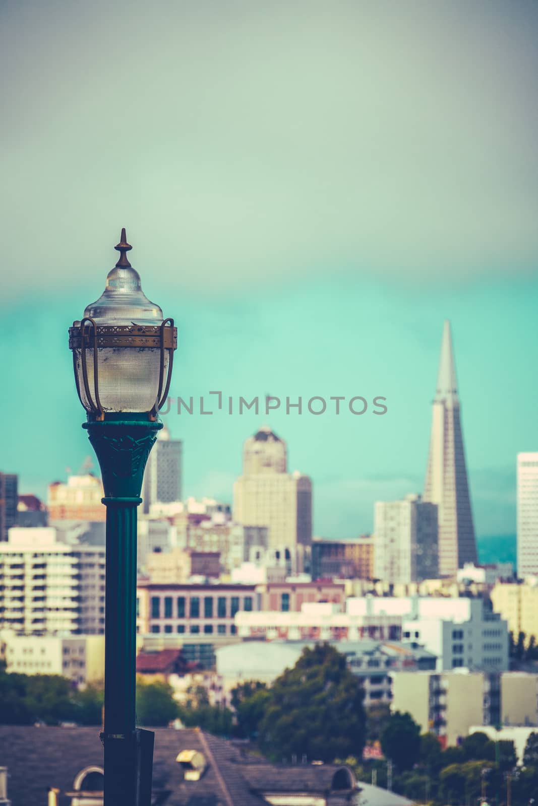 Retro Style Photo Of The San Francisco Skyline With Vintage Lamp In Foreground And Copy Space