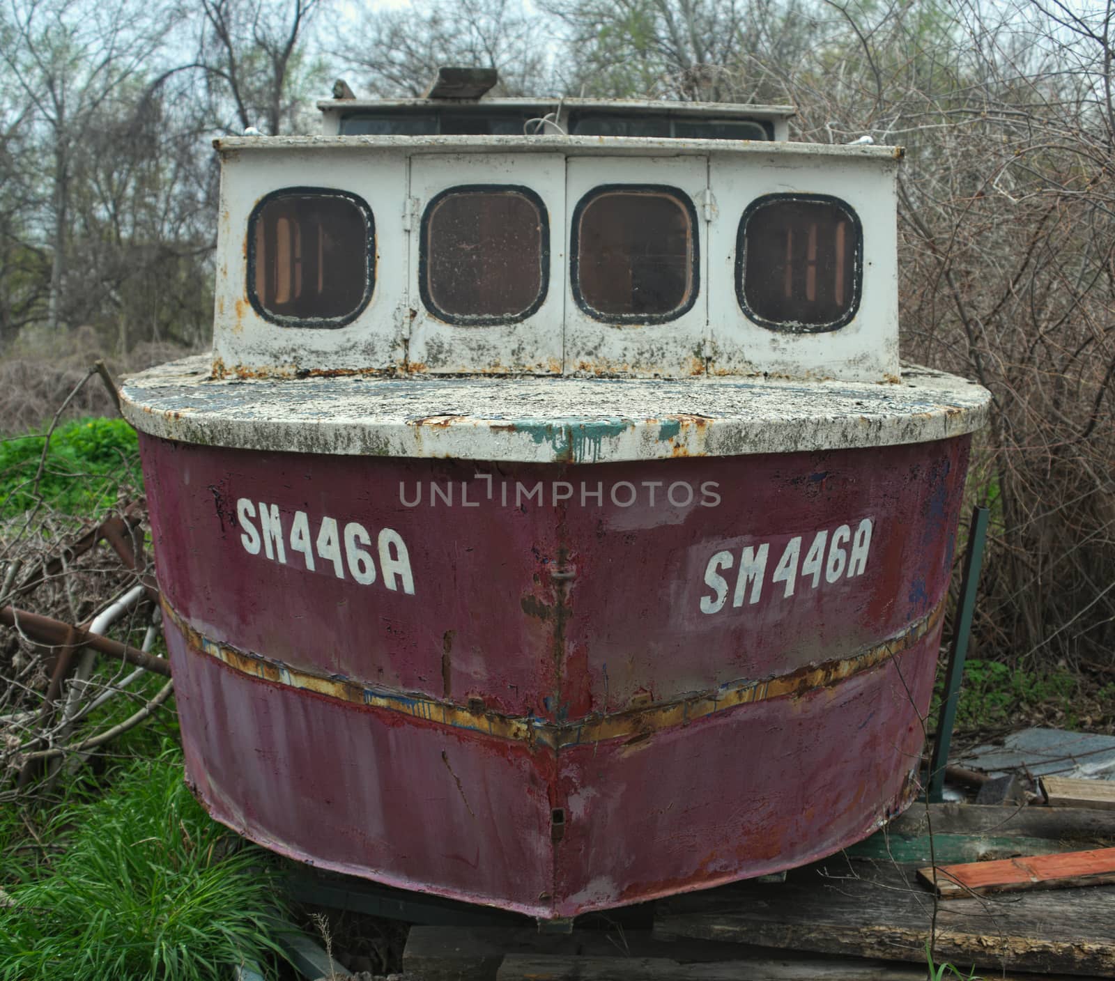 Old abandoned wrecked boat at river shore