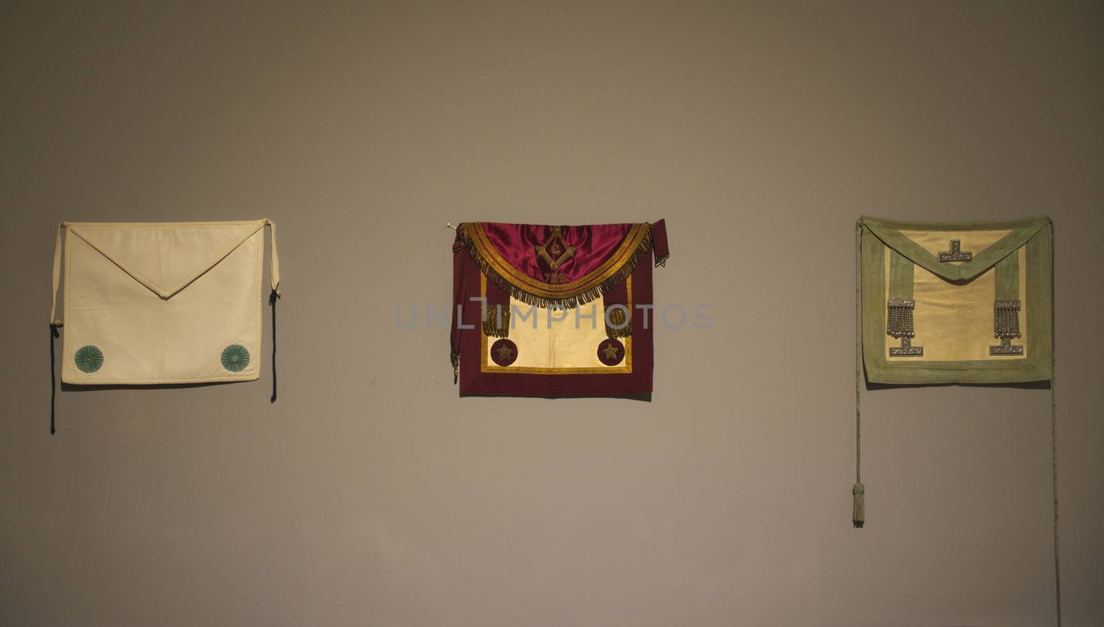 masonic cloths on white wall in museum by sheriffkule