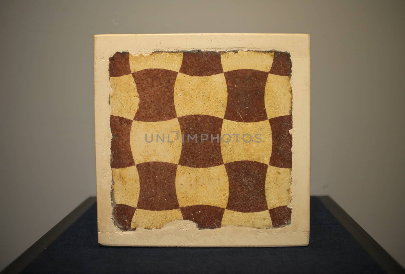 Box with abstract chess like drawings on plush table by sheriffkule