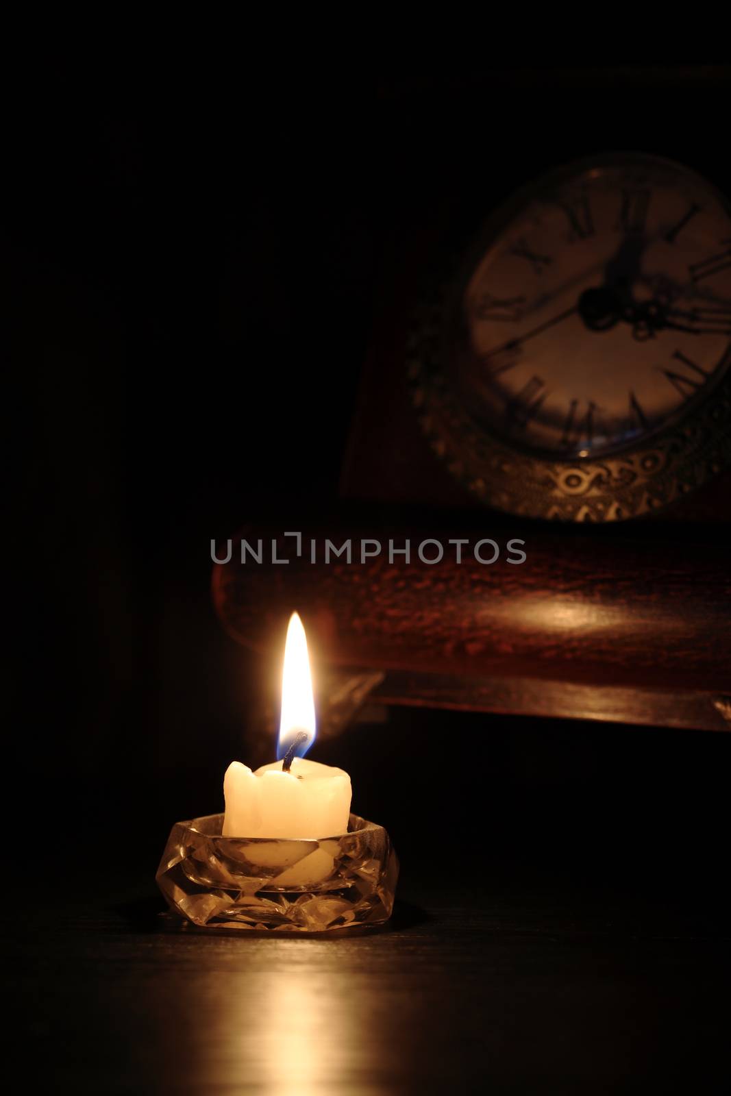 Candle Near Clock by kvkirillov