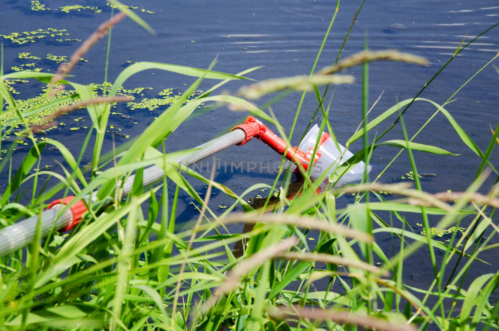 Take samples of water for laboratory testing. The concept - analysis of water purity, environment, ecology
