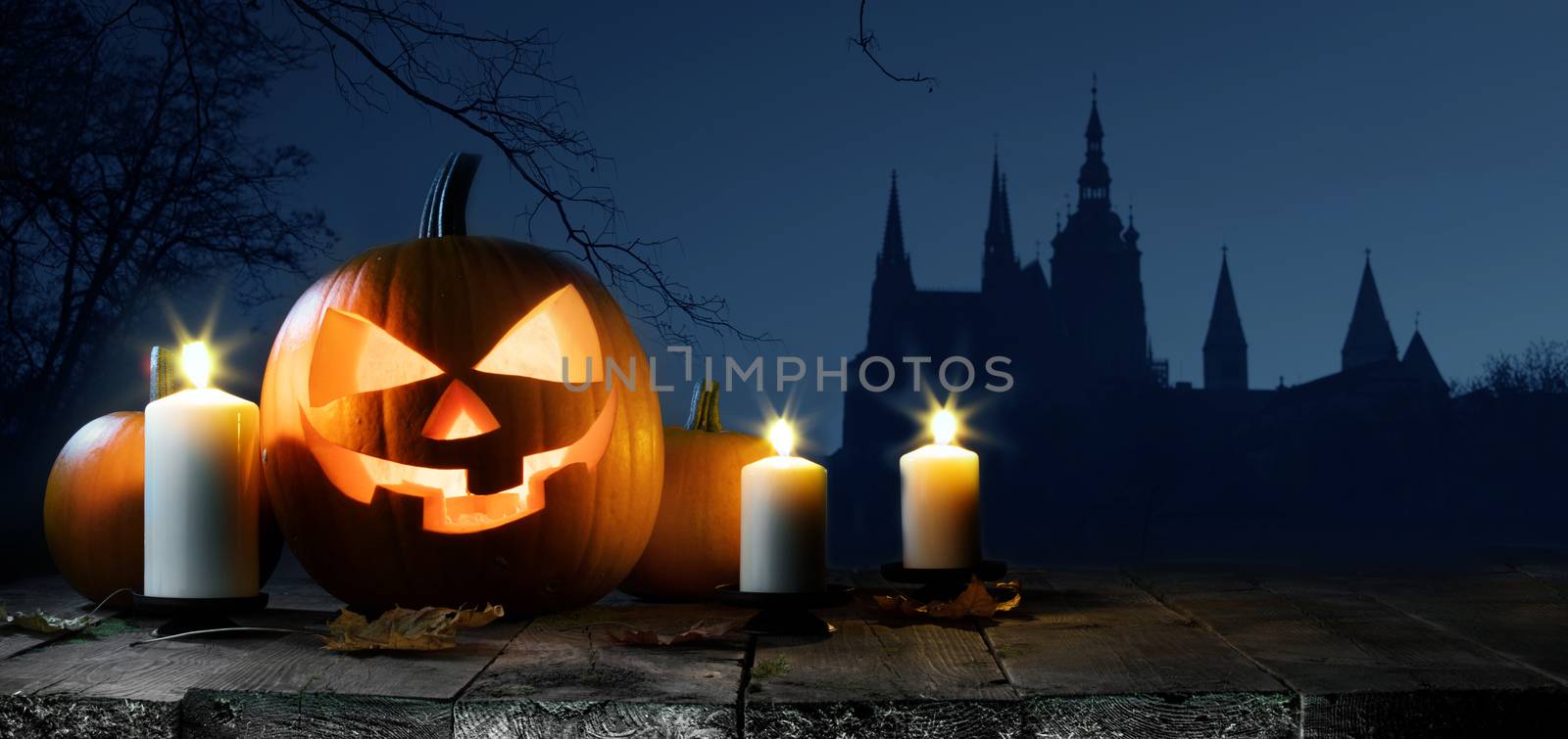 Halloween card with pumpkin and candles, gothic castle, trees and flying bats silhouette on background
