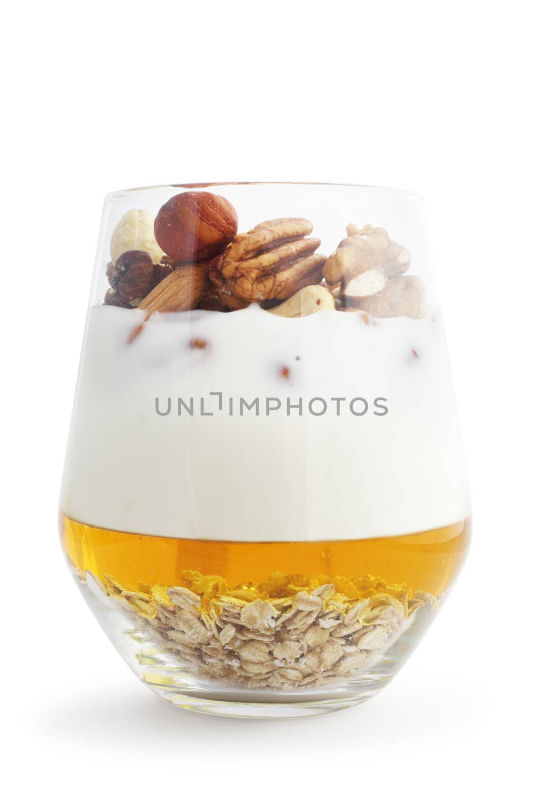 Breakfast smoothie ingredients in glass, cooking making concept, isolated on white background. Milkshake. Protein diet. Healthy food concept. Drink, oat flakes, milk, yoghurt, honey, nuts