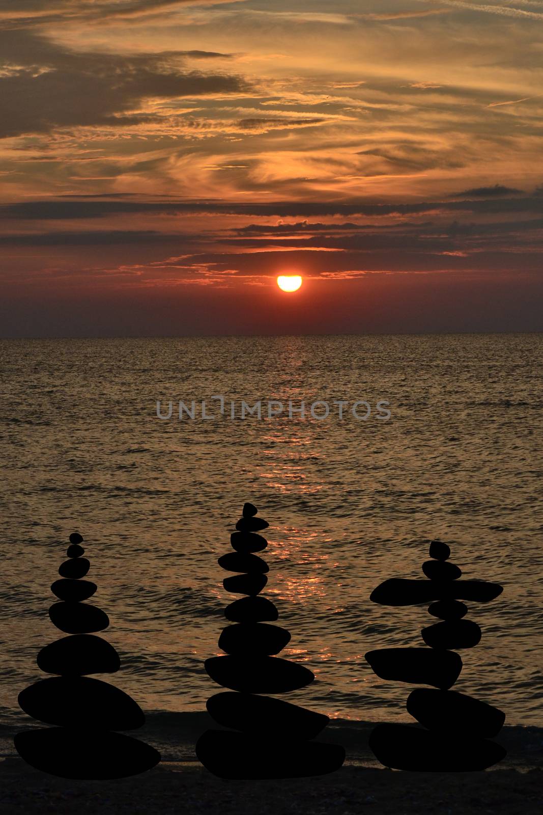 Relax zen stones balanced. Black pebbles at sunris by hibrida13