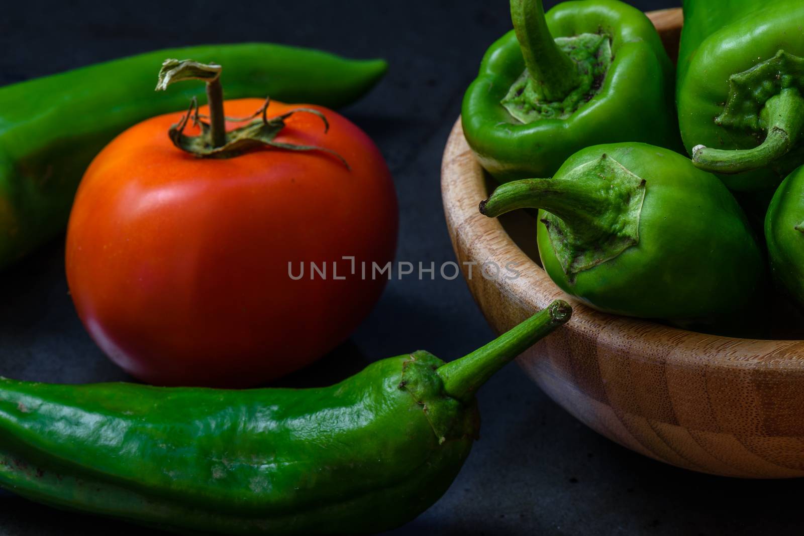 tomato and chili pepper on a dark background by Seva_blsv