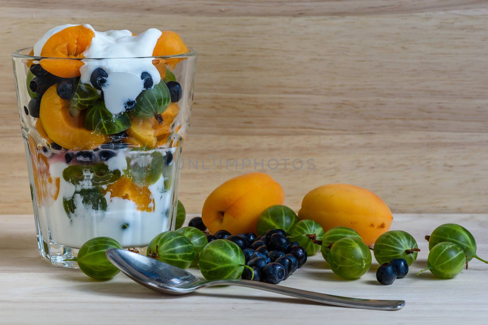 Summer fruit and berry dessert in glass. by Seva_blsv