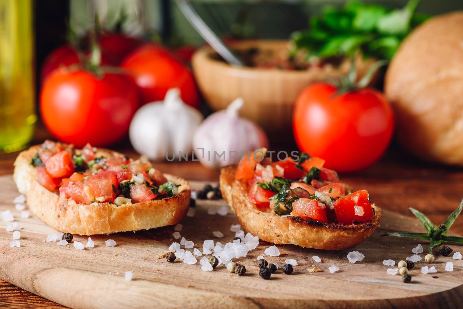Classic Bruschettas with Tomatoes and Ingredients on background