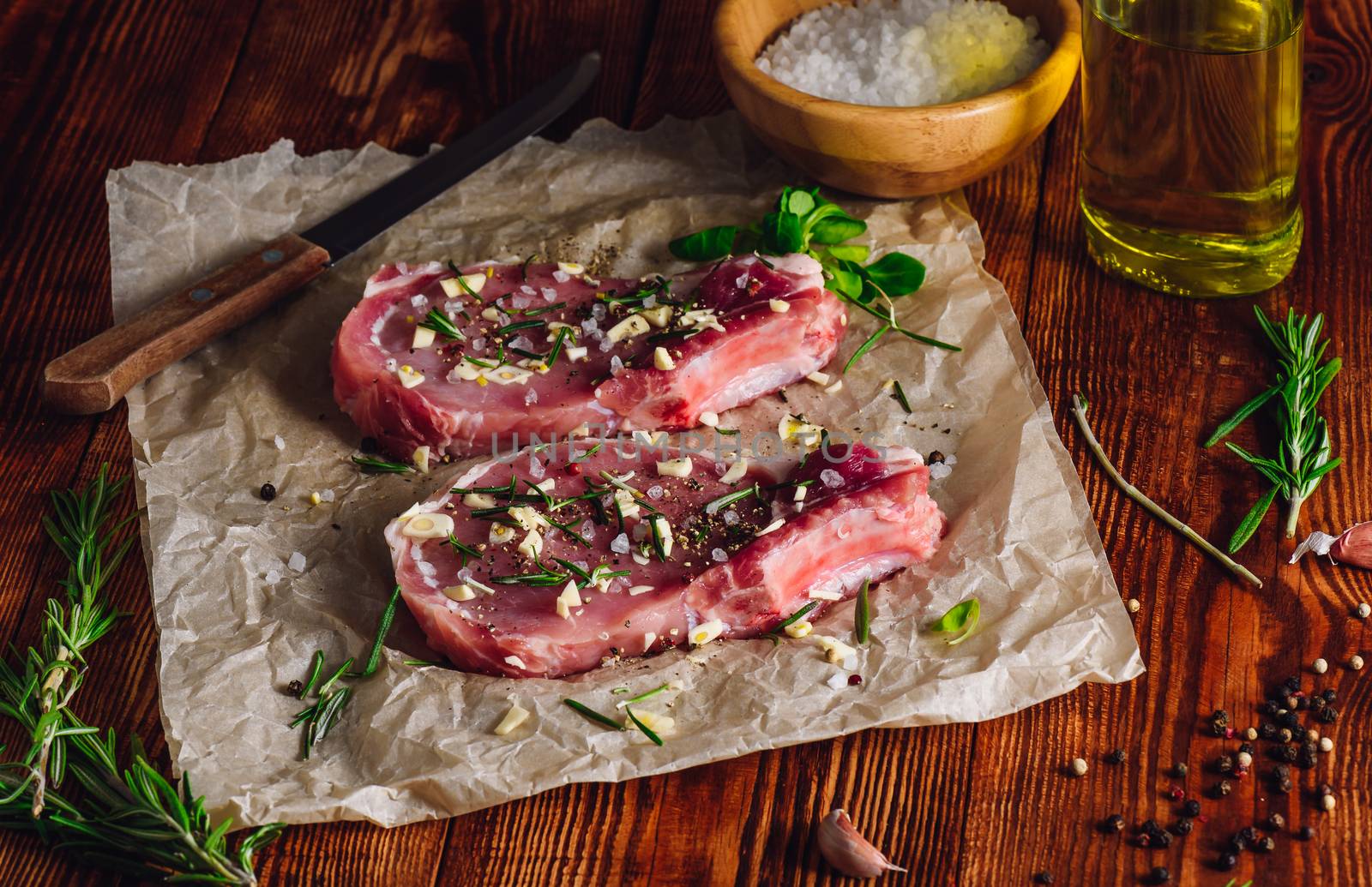 Two Rib Steaks with Spices Prepared for Frying.