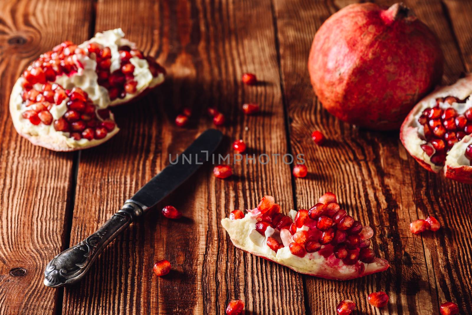 Opened Pomegranate Fruit, Seeds and Vintage Knife