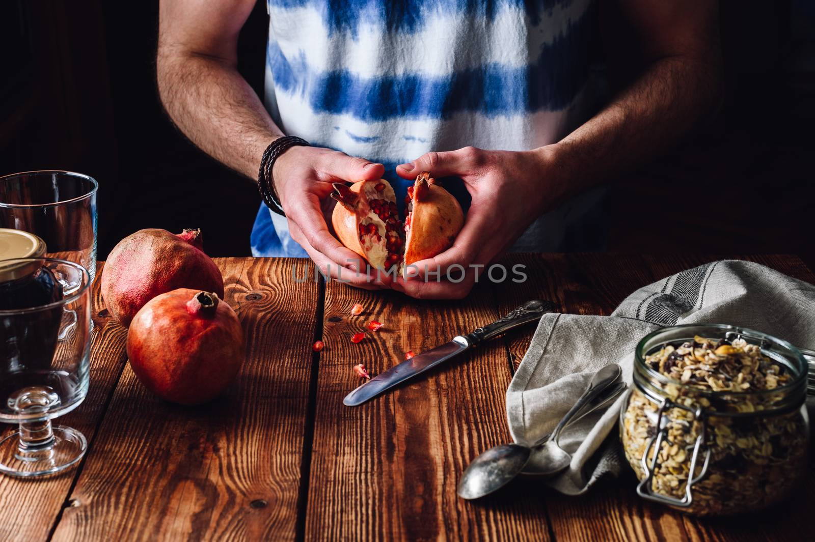 Man Opens Pomegranate. by Seva_blsv