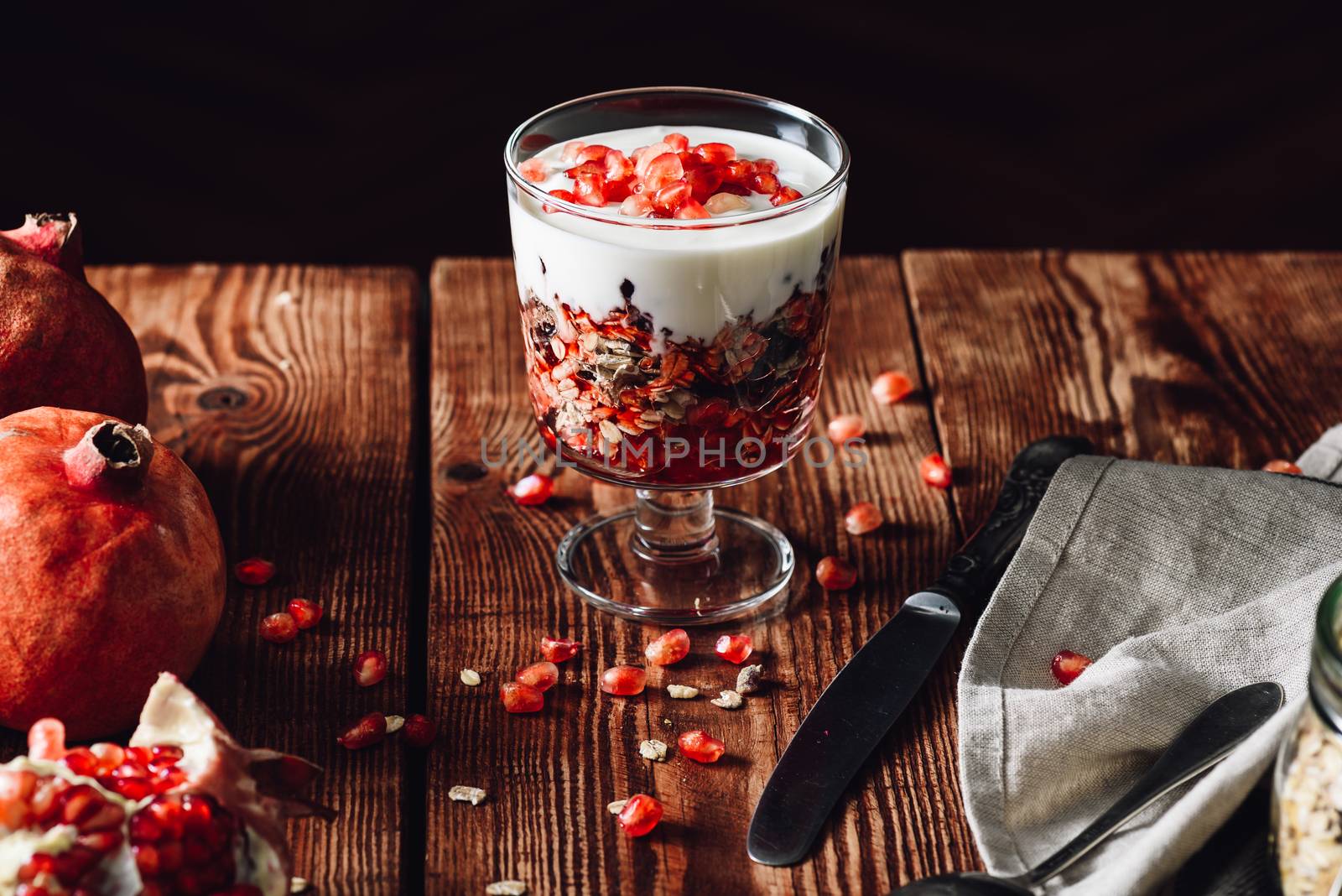 Cooked Dessert with Ingredients on Wooden Table. Series on Prepare Healthy Dessert with Pomegranate, Granola, Cream and Jam
