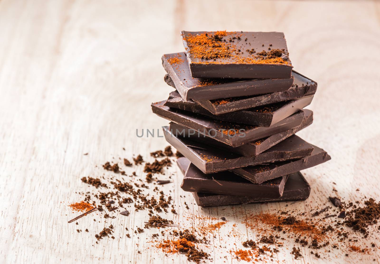 Stack of Chocolate Bar with Cayenne powder.